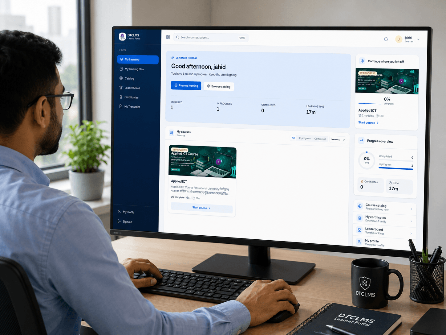 An administrator reviewing the DTCLMS learner portal on a desktop